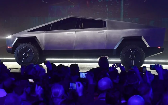 Tesla Cybertruck Tesla is bracing for a busy 2022 with new plants and the Cybertruck coming on line, but safety probes may rein in its stock im-368621?width=700&height=439