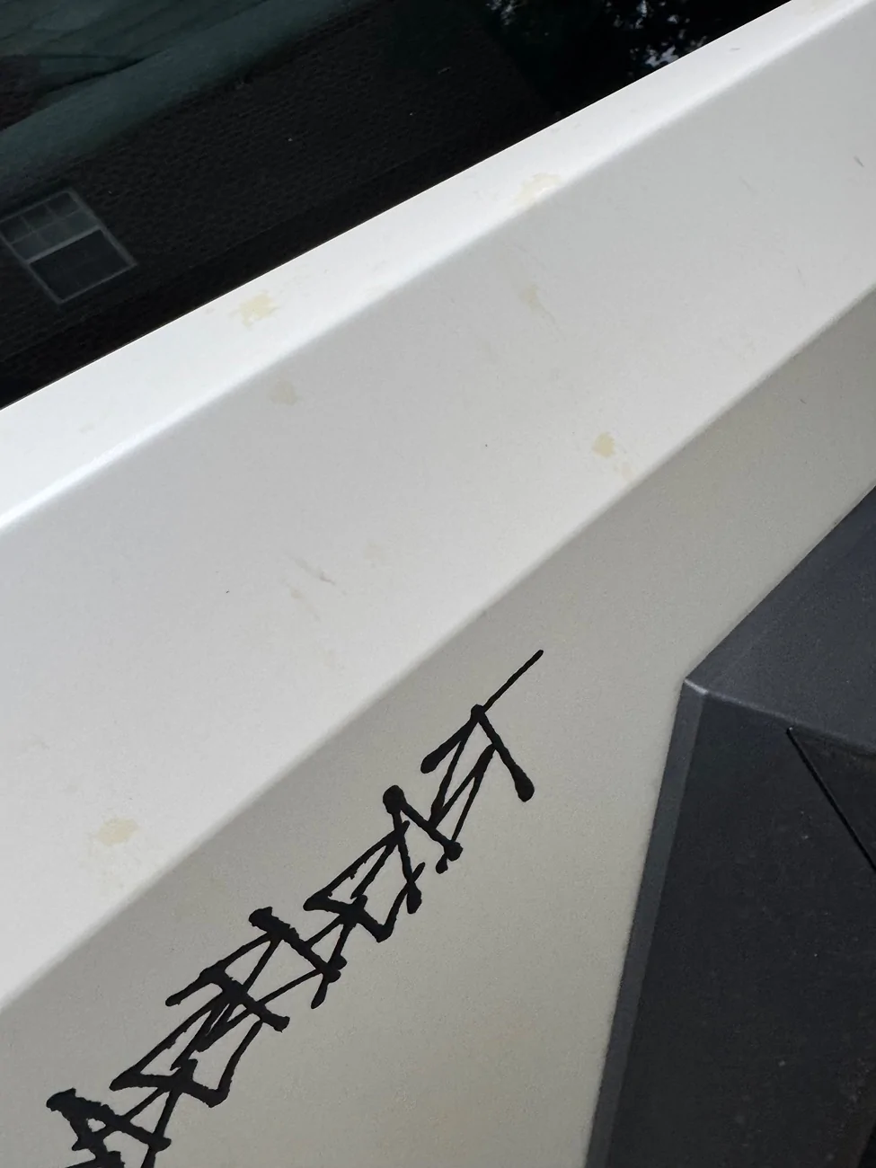 Tesla Cybertruck Cybertruck wrap stains…satin crystal white IMG_1915