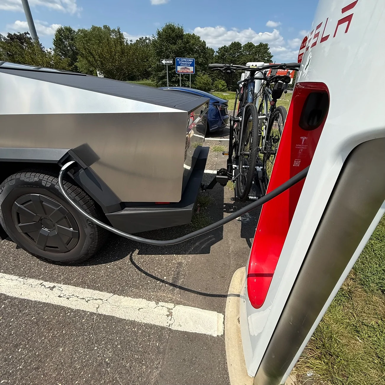 Tesla Cybertruck Bike rack installed and need a supercharger? No problem w/ Thule EasyFold XT 2-bike hitch rack IMG_0591