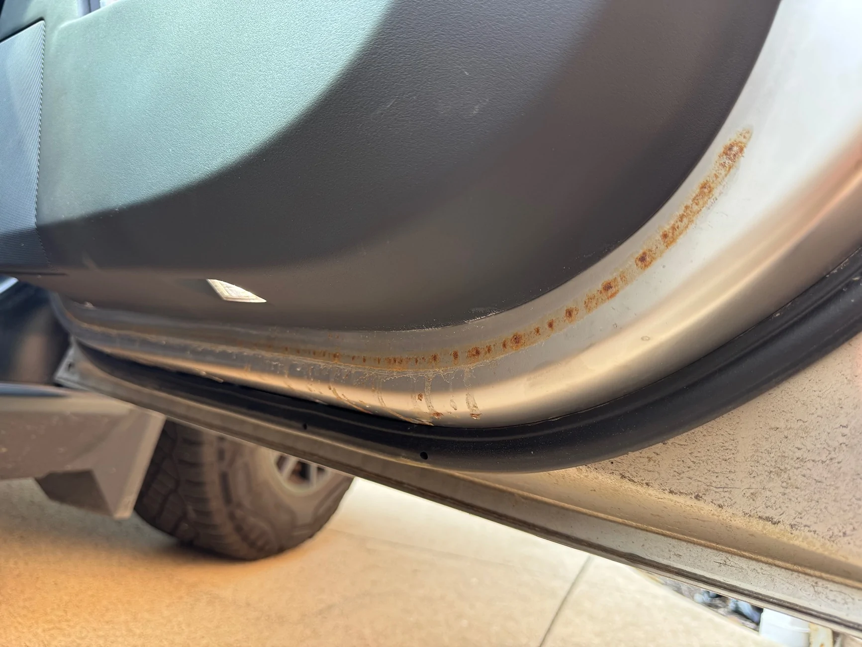 Tesla Cybertruck Surface rust on the lower part of my doors. tempImagedxQjR