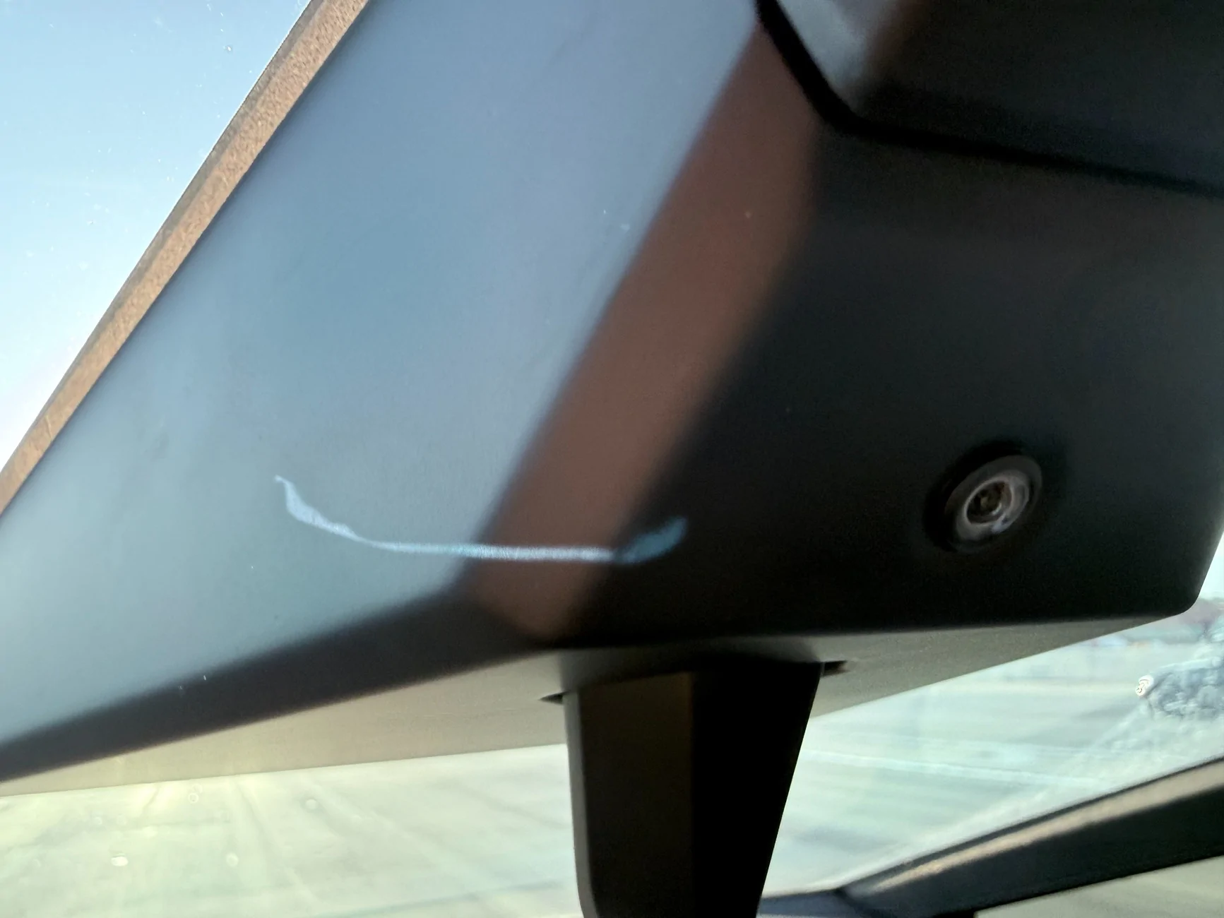 Tesla Cybertruck Weird see-through plastic "Scratches" behind camera IMG_7915