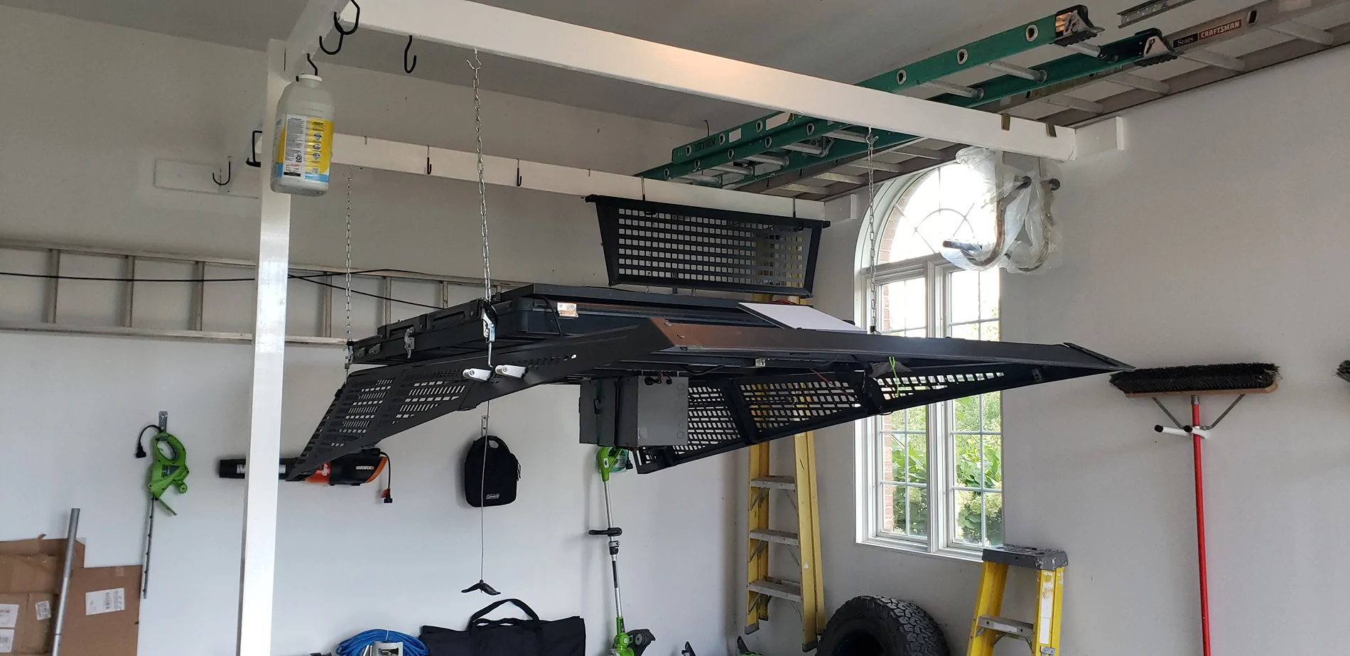 Tesla Cybertruck Removing my Urander bedrack using custom overhead frame in garage ceiling Bedrack Removal 3