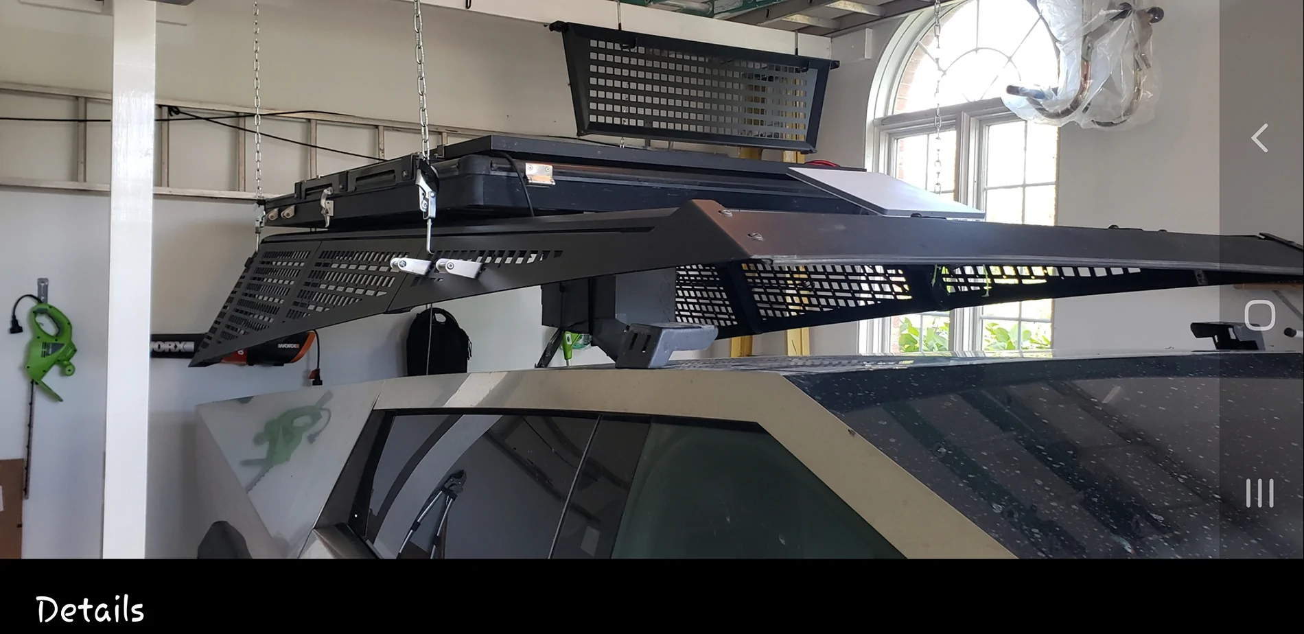 Tesla Cybertruck Removing my Urander bedrack using custom overhead frame in garage ceiling Bedrack Removal 2