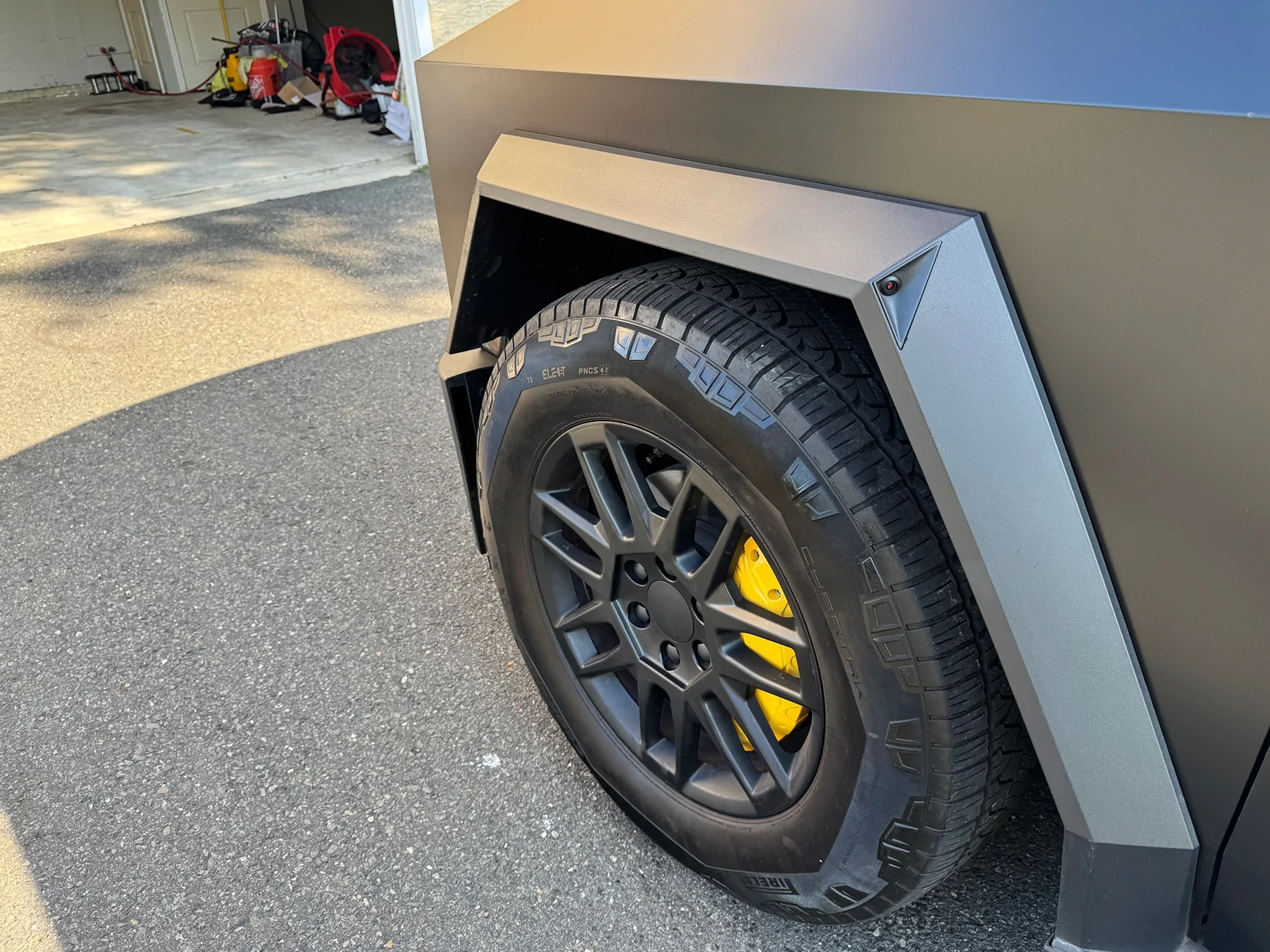 Tesla Cybertruck Are these the same brake caliper covers? IMG_0467