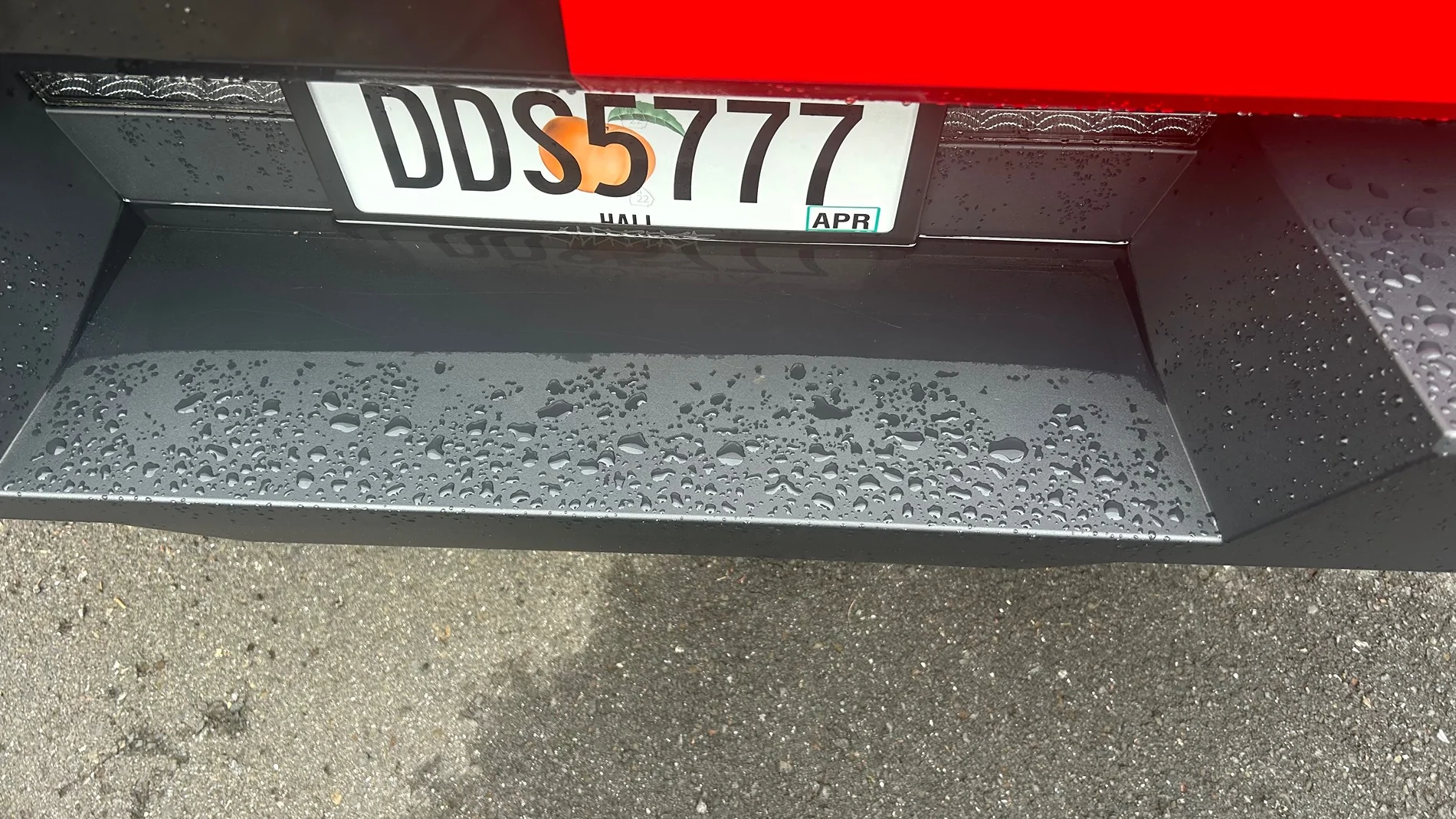 Tesla Cybertruck Water puddling on the rear bumper and license plate. IMG_0491