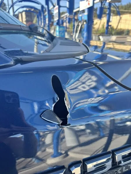 Tesla Cybertruck Water puddling on the rear bumper and license plate. 1758907688950-p4