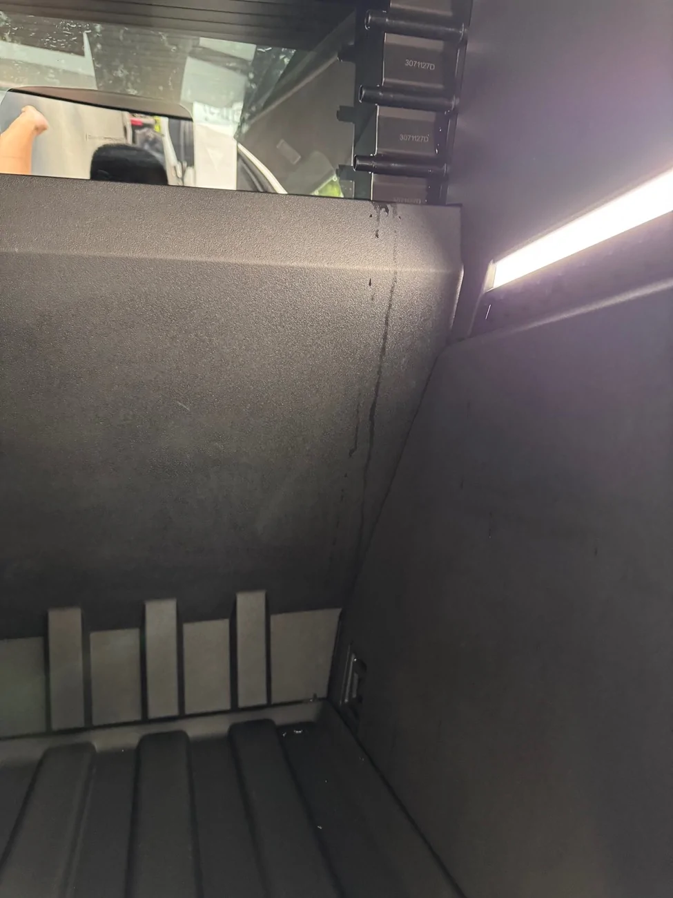 Tesla Cybertruck Is very small amount of water leaking into the bed within spec? IMG_8253