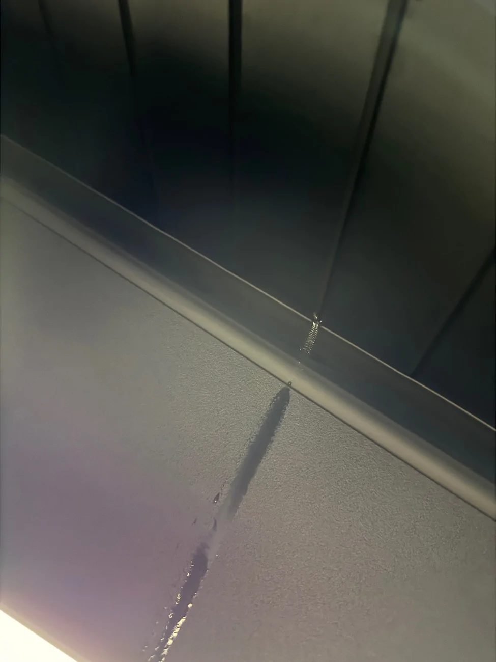 Tesla Cybertruck Real world test - water got in between tonneau bed cover slats in the middle section IMG_8528