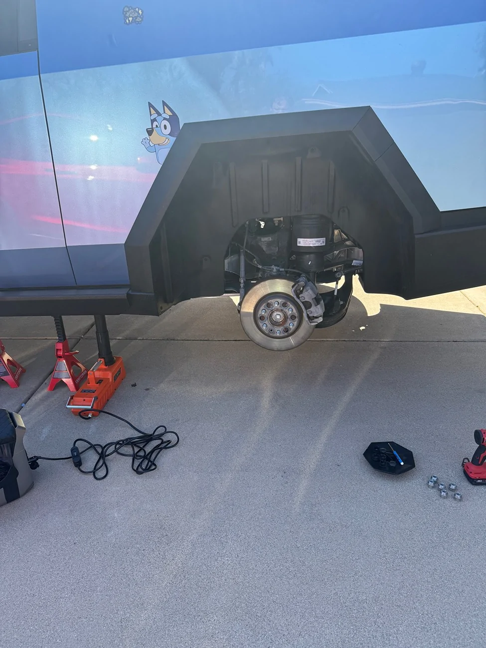 Tesla Cybertruck Are these the same brake caliper covers? IMG_6751