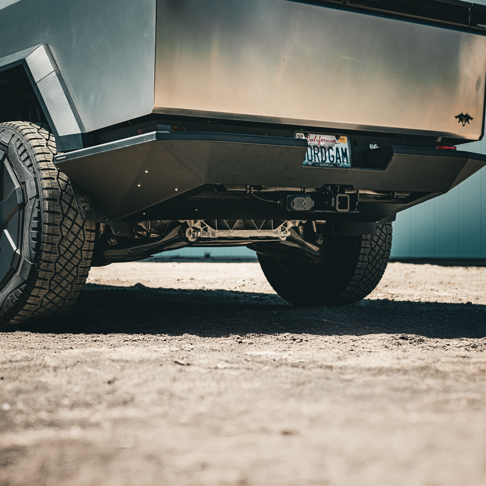 Tesla Cybertruck CybertruckCo Solar Frunk, Urander Rack 2.0, Unplugged Performanece Side Molle Sail Panels, and TSportLine CTX Front Bumper tesla-cybertruck-offroad-rear-bumper-from-cybertruuckco-14