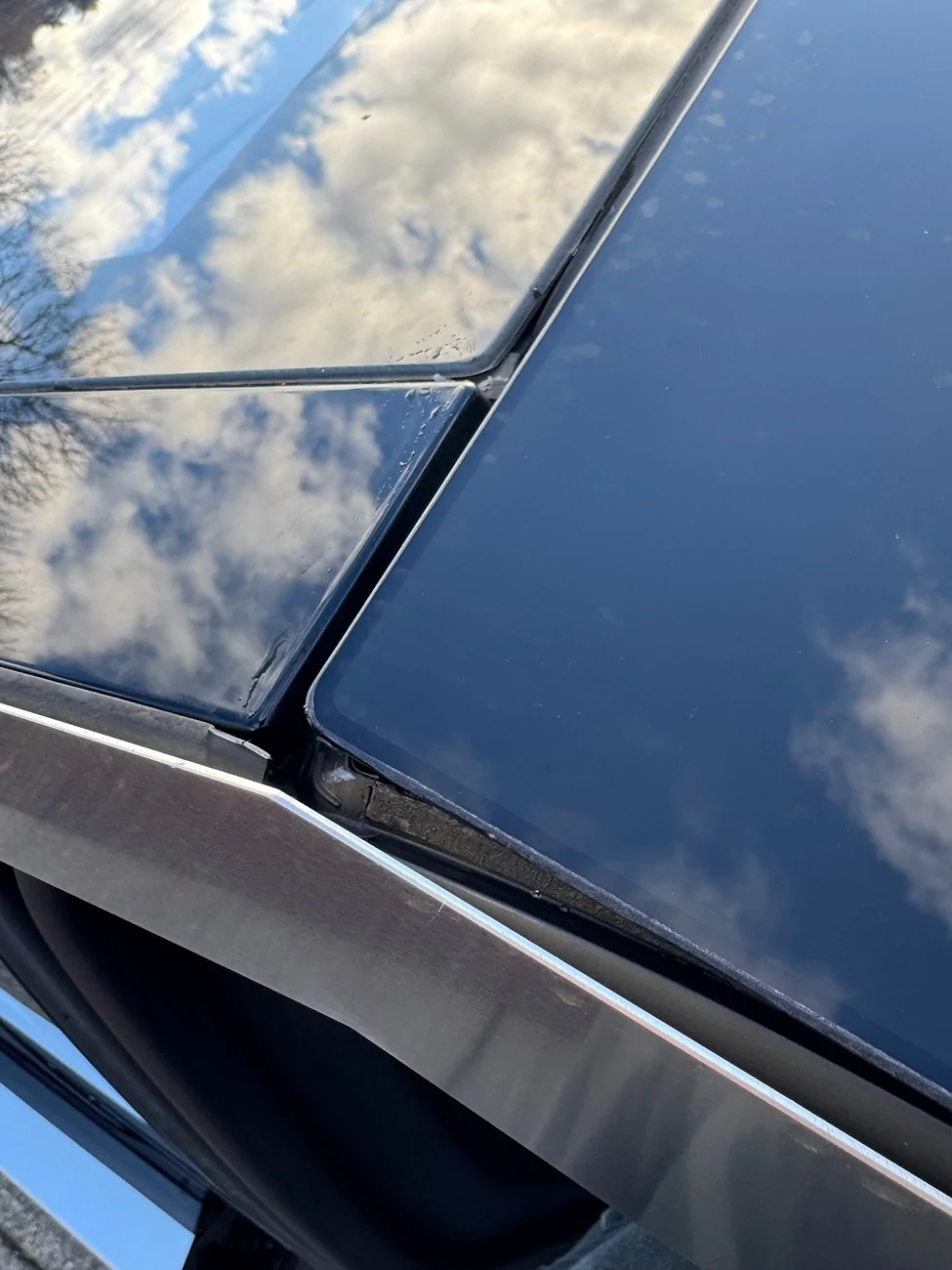 Tesla Cybertruck Windshield seals failed… charging for windshield? IMG_5529