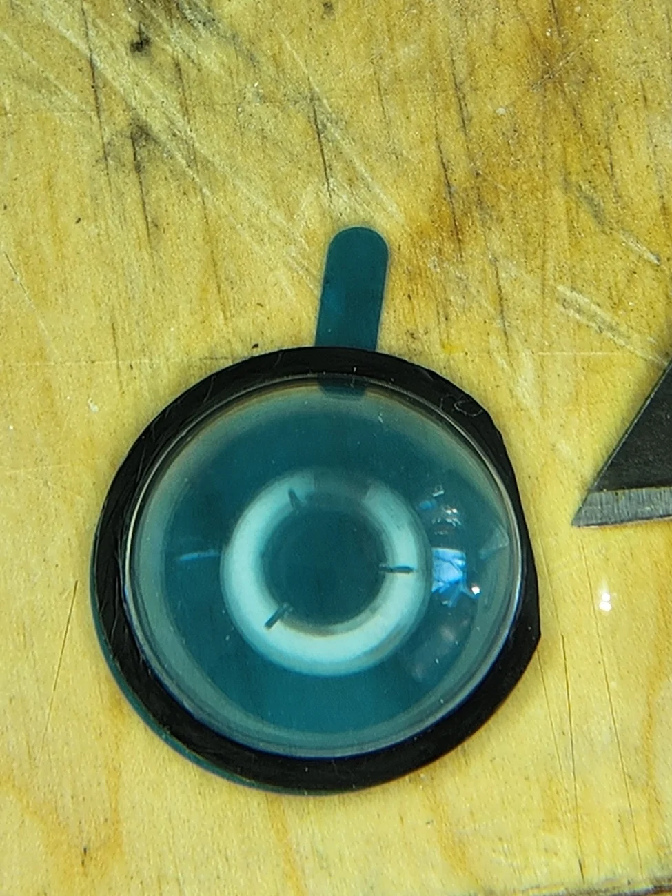 Tesla Cybertruck Front license plate camera glass getting worn from road stuff - any replacement or protection options? 20251203_130530
