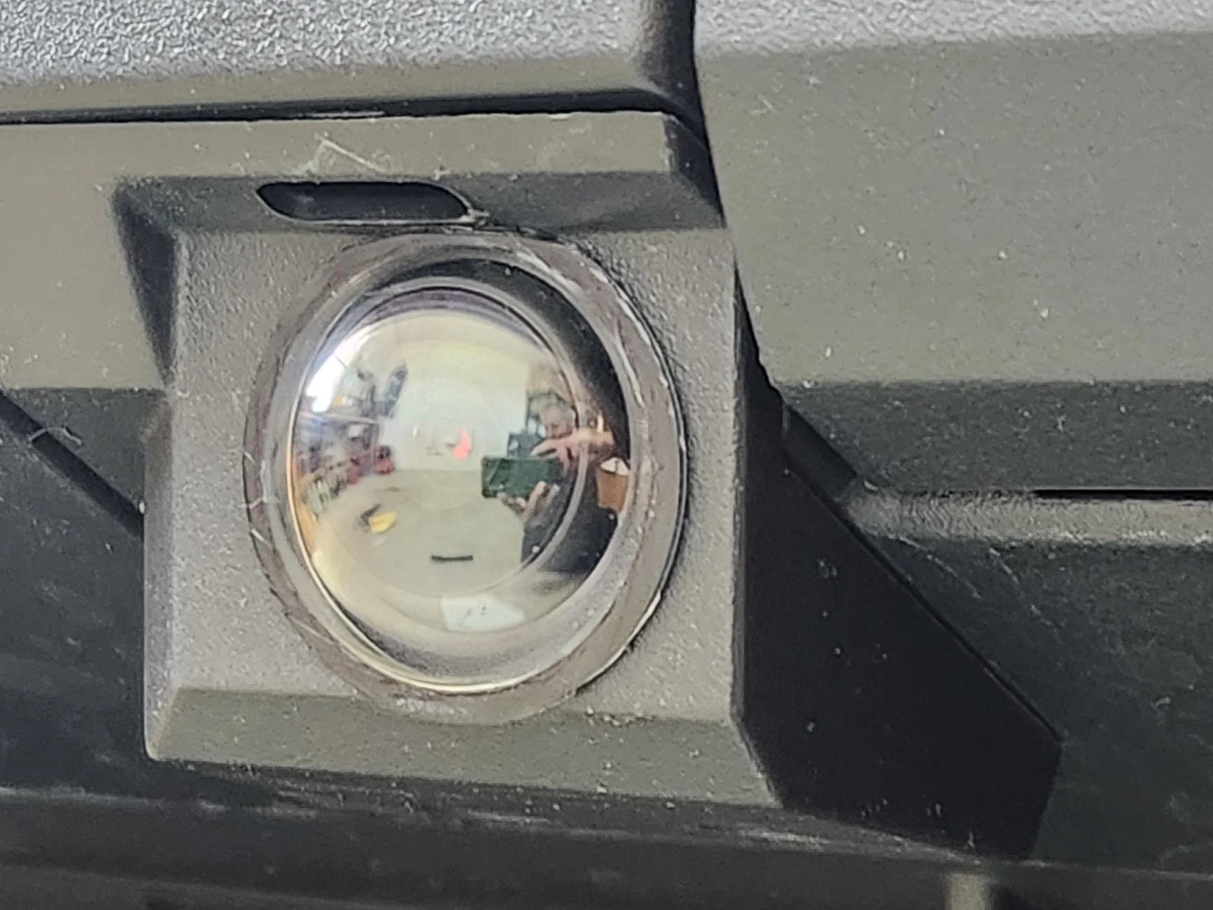Tesla Cybertruck Front license plate camera glass getting worn from road stuff - any replacement or protection options? 20251203_131912