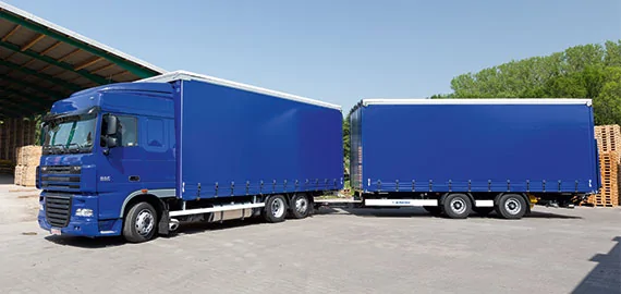 Tesla Cybertruck How many Miles Will my EV Get When Towing? load_carrier_through-loading_trailer