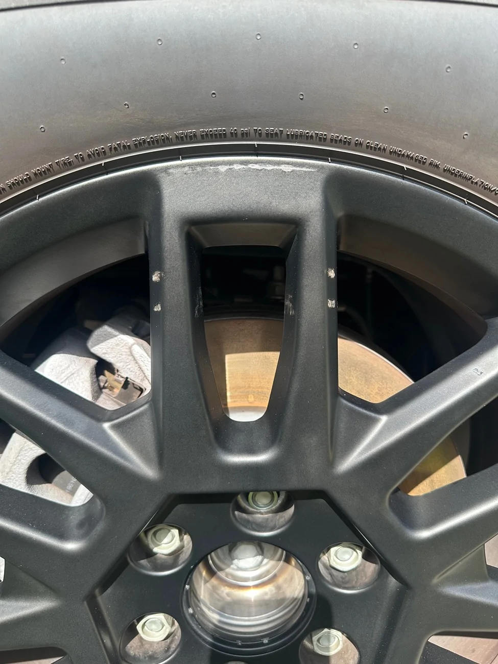 Tesla Cybertruck Prevent wheel abrasion from core wheel covers by using liquid rubber padding or wire harness tape IMG_2905