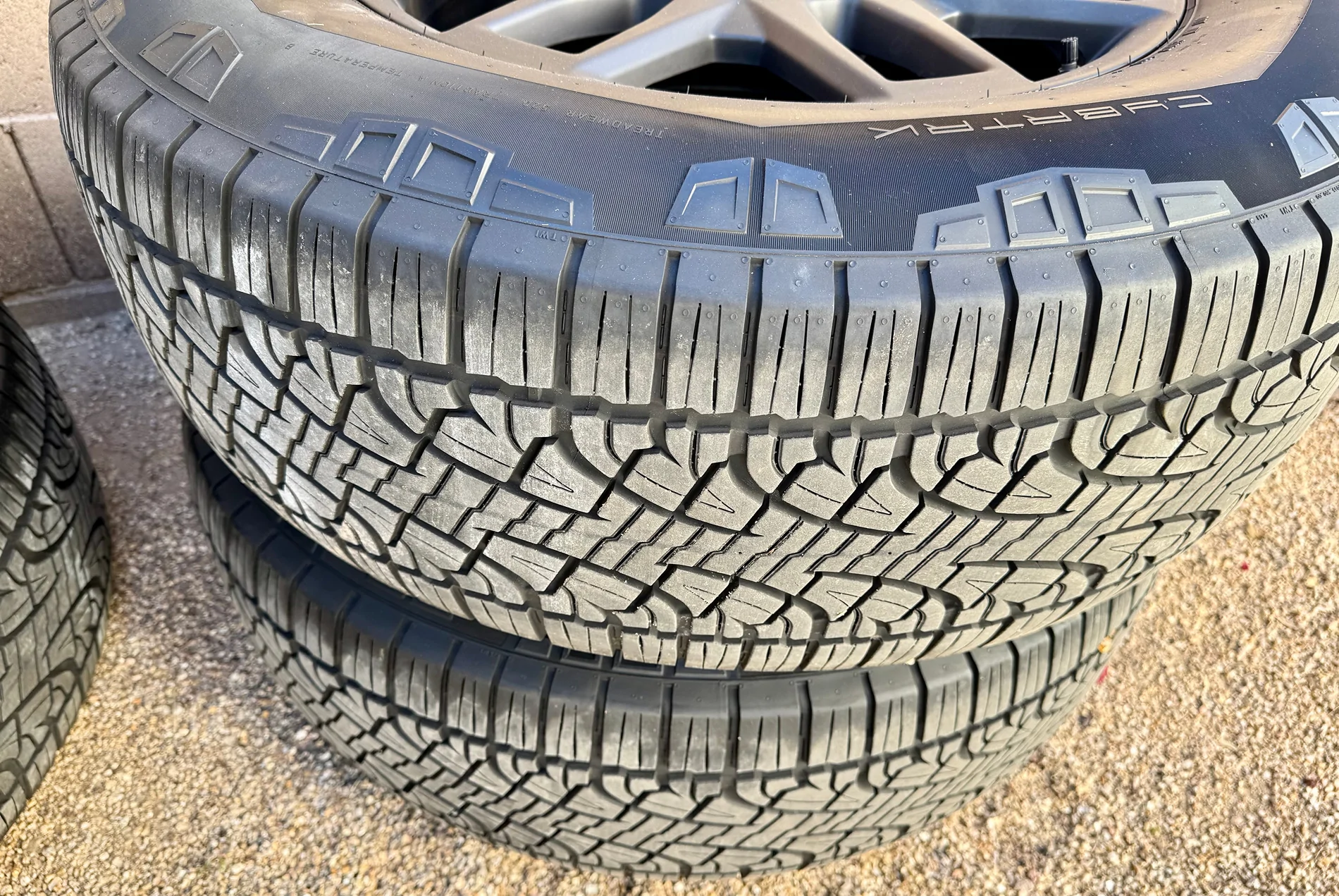 Tesla Cybertruck FS - 2025 Tesla Cybertruck 20" OEM Core Wheels & Pirelli Scorpion Tires - Complete Set w/ TPMS & Covers TESLA CYBERTRUCK TIRES SIDE VIEW 1