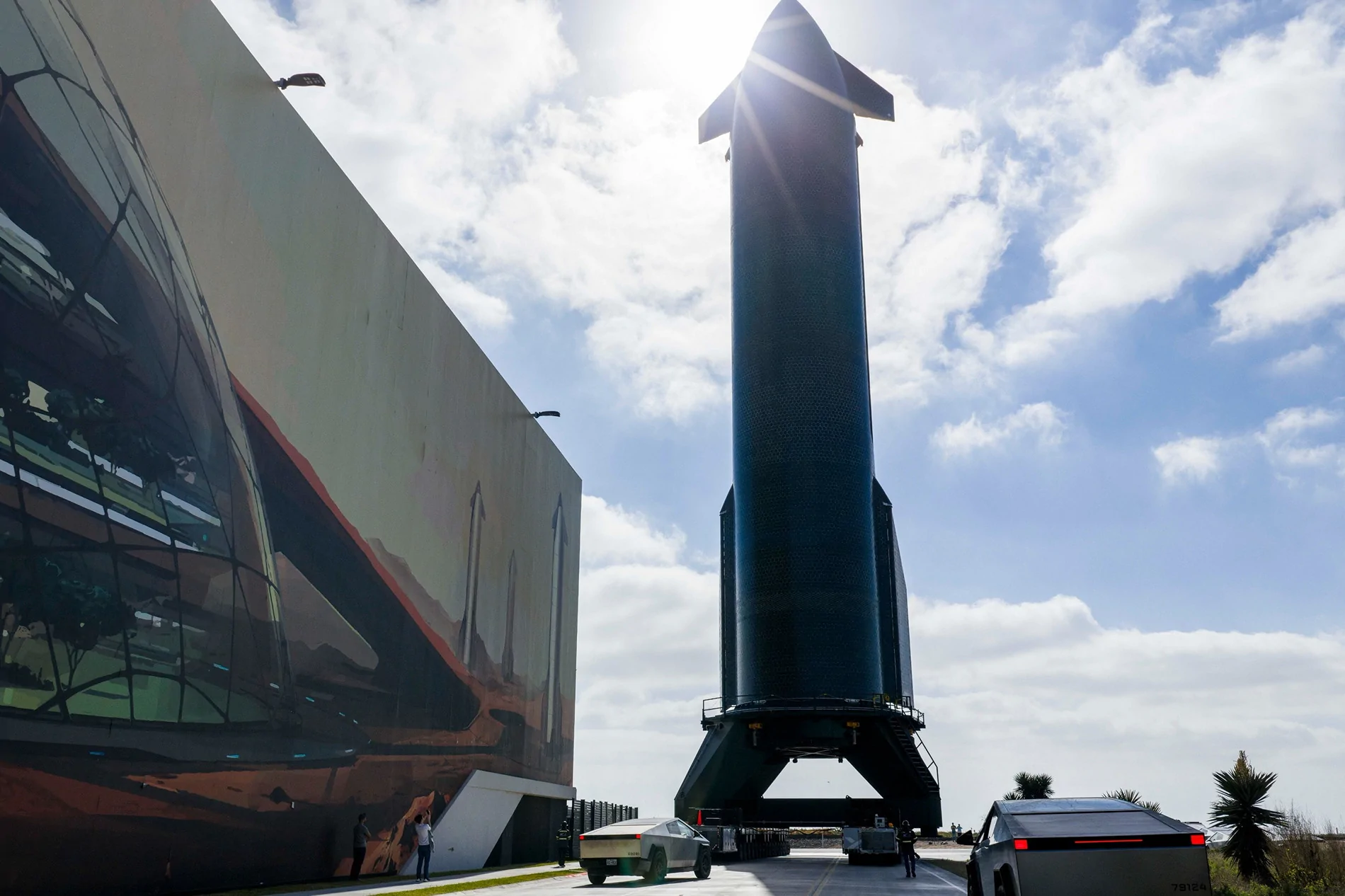 Tesla Cybertruck Seeing pics of Starship 39 and CTs cybertrucks-escorting-the-starship-v3-to-prelaunch-testing-is-a-glimpse-into-the-future_3