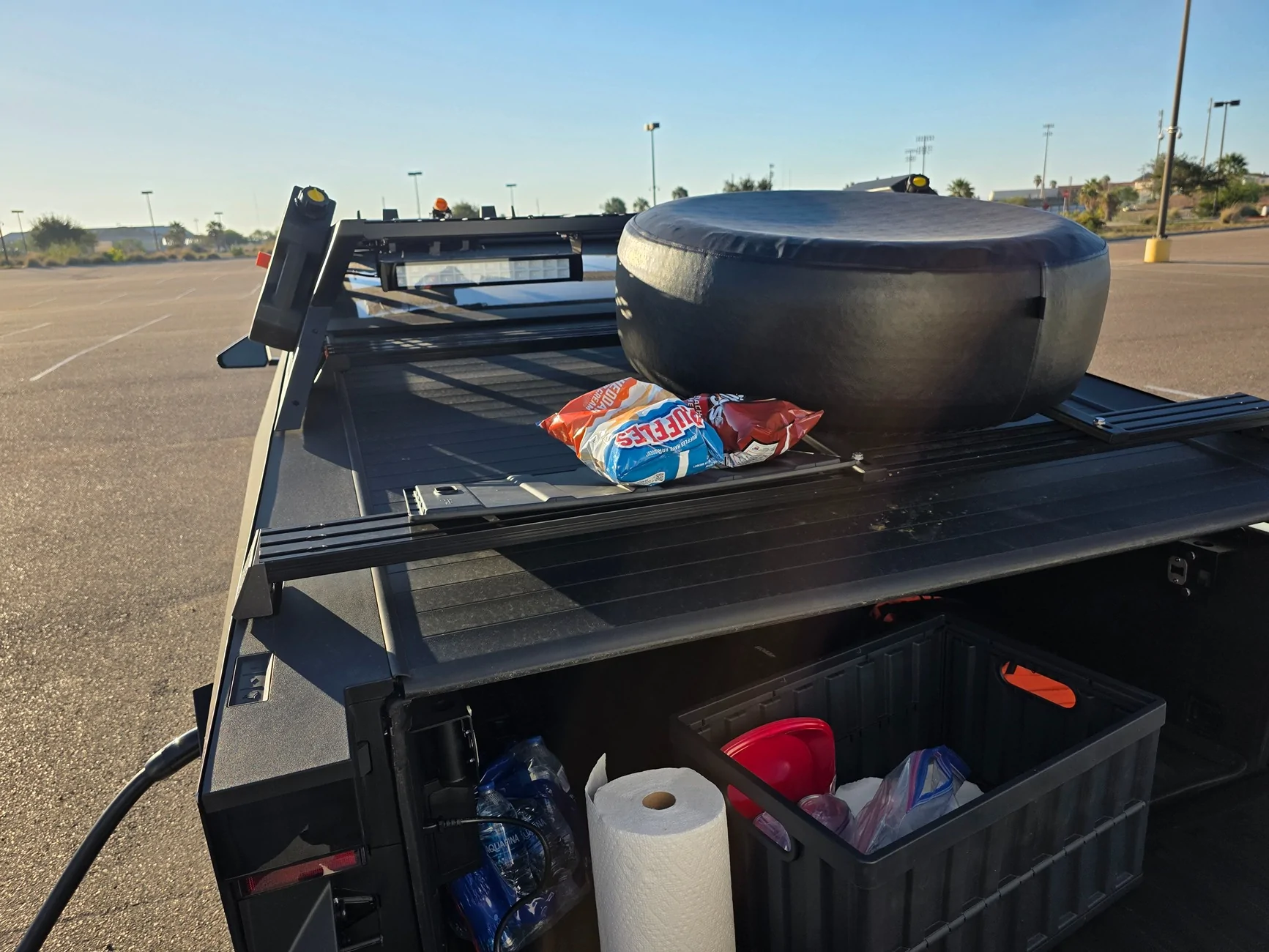 Tesla Cybertruck Spare tire storage idea: deflate it and stand it up in bed 1000014045
