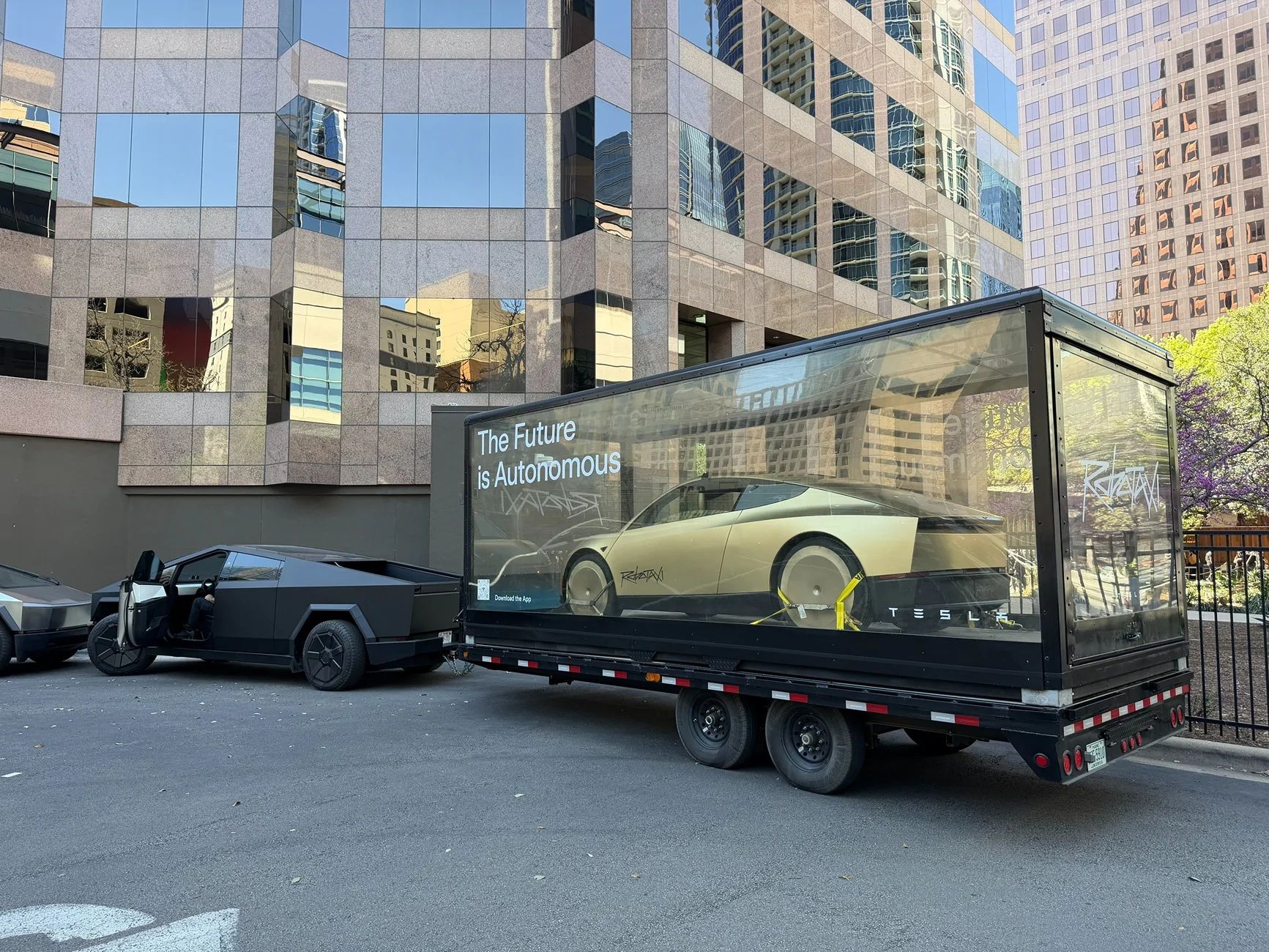 Cybercab Robotaxi Cybercab & Optimus display case towed by Cybertruck Cybertruck tows a Cybercab & Optimus in display case 5