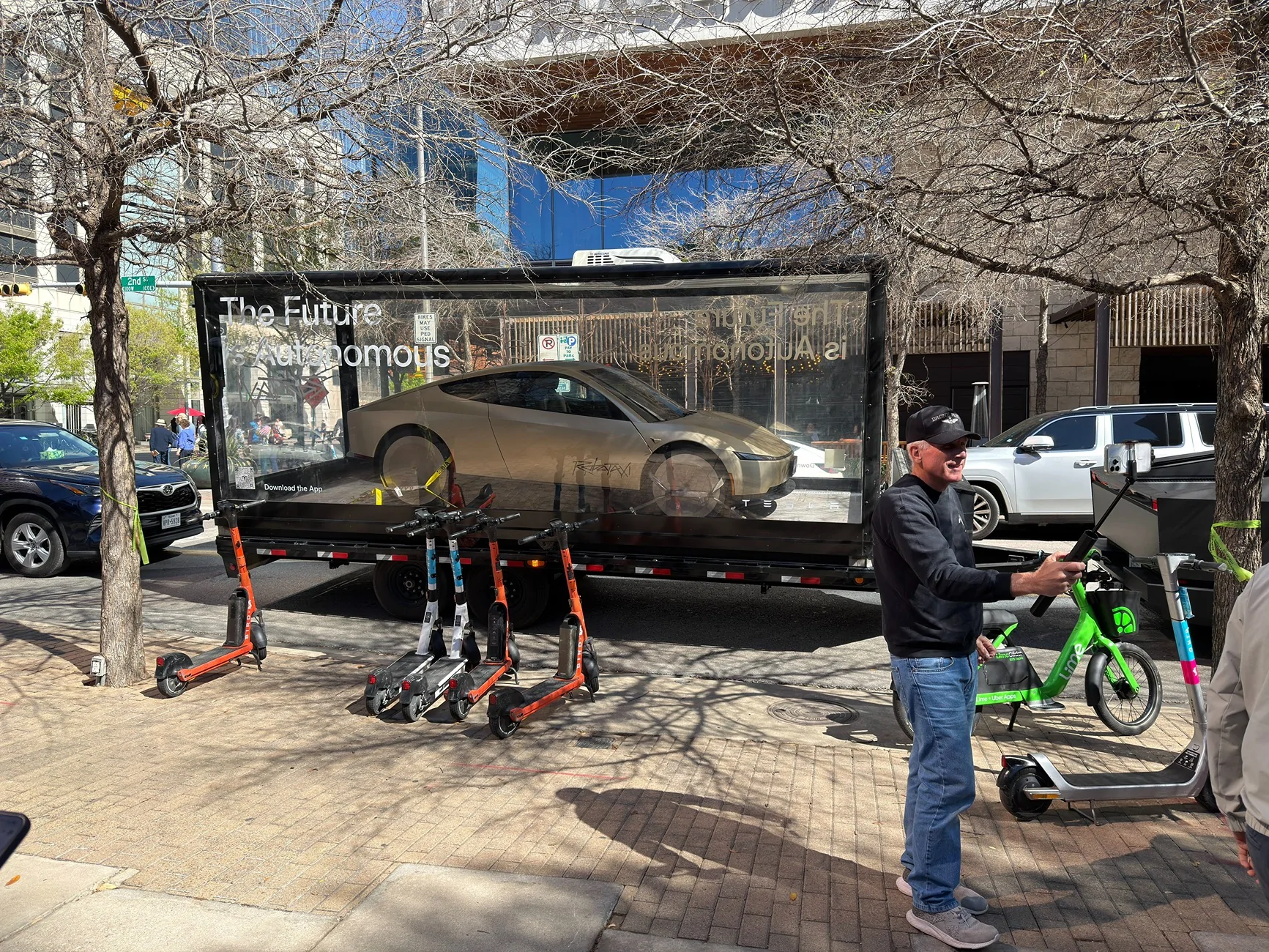 Cybercab Robotaxi Cybercab & Optimus display case towed by Cybertruck Cybertruck tows a Cybercab & Optimus in display case 5