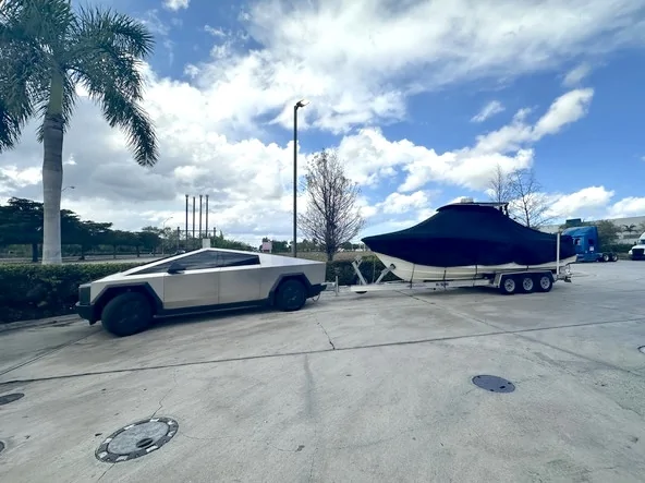 Tesla Cybertruck Quick trip to top off trailer tires, while towing boat 115514-f214962152abcf4b7f9315e0826476ec