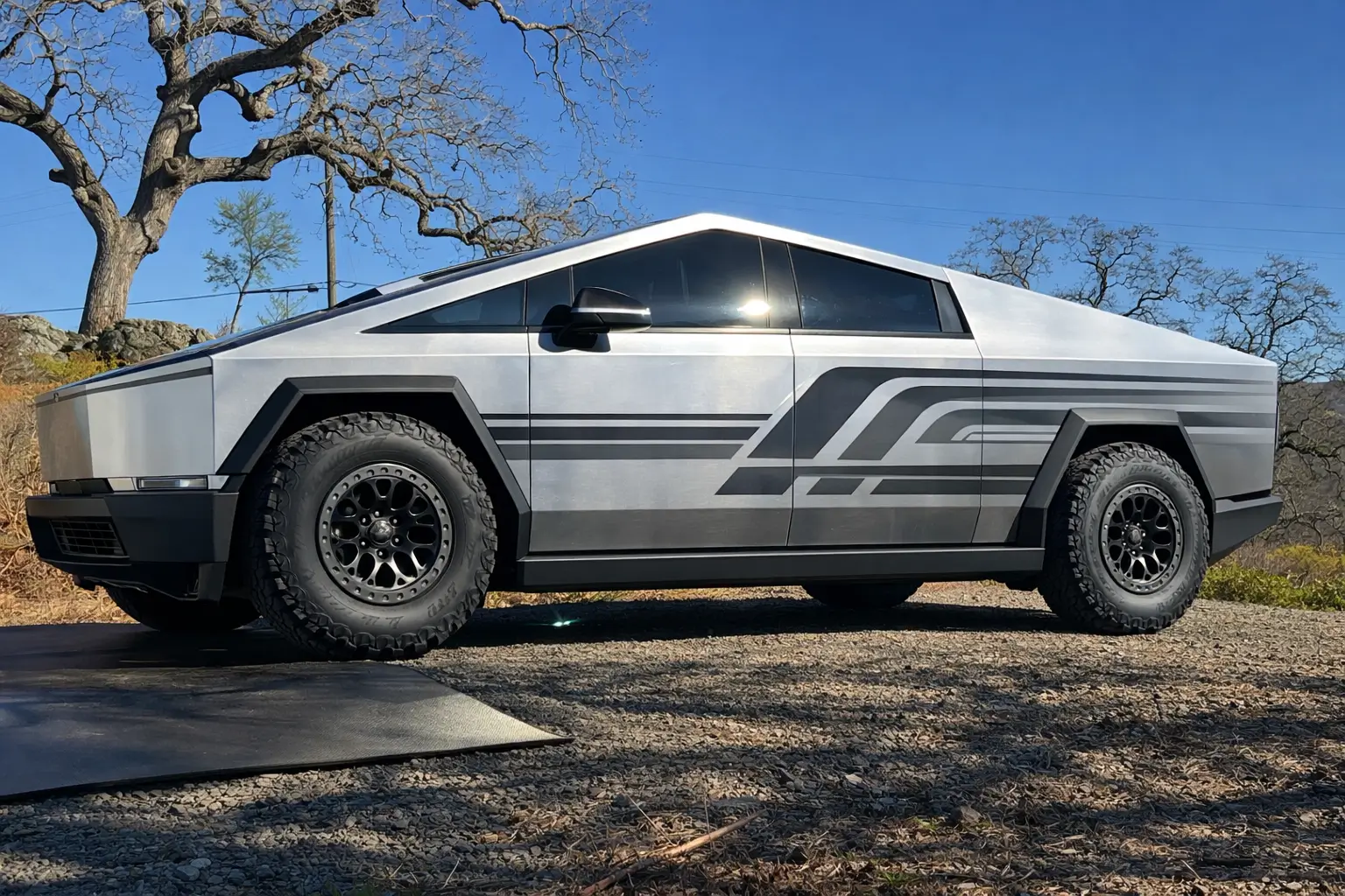 Tesla Cybertruck Adding graphics with vinyl decals on stainless steel (instead of full wrap) - experts please chime in! cybertruck graphics