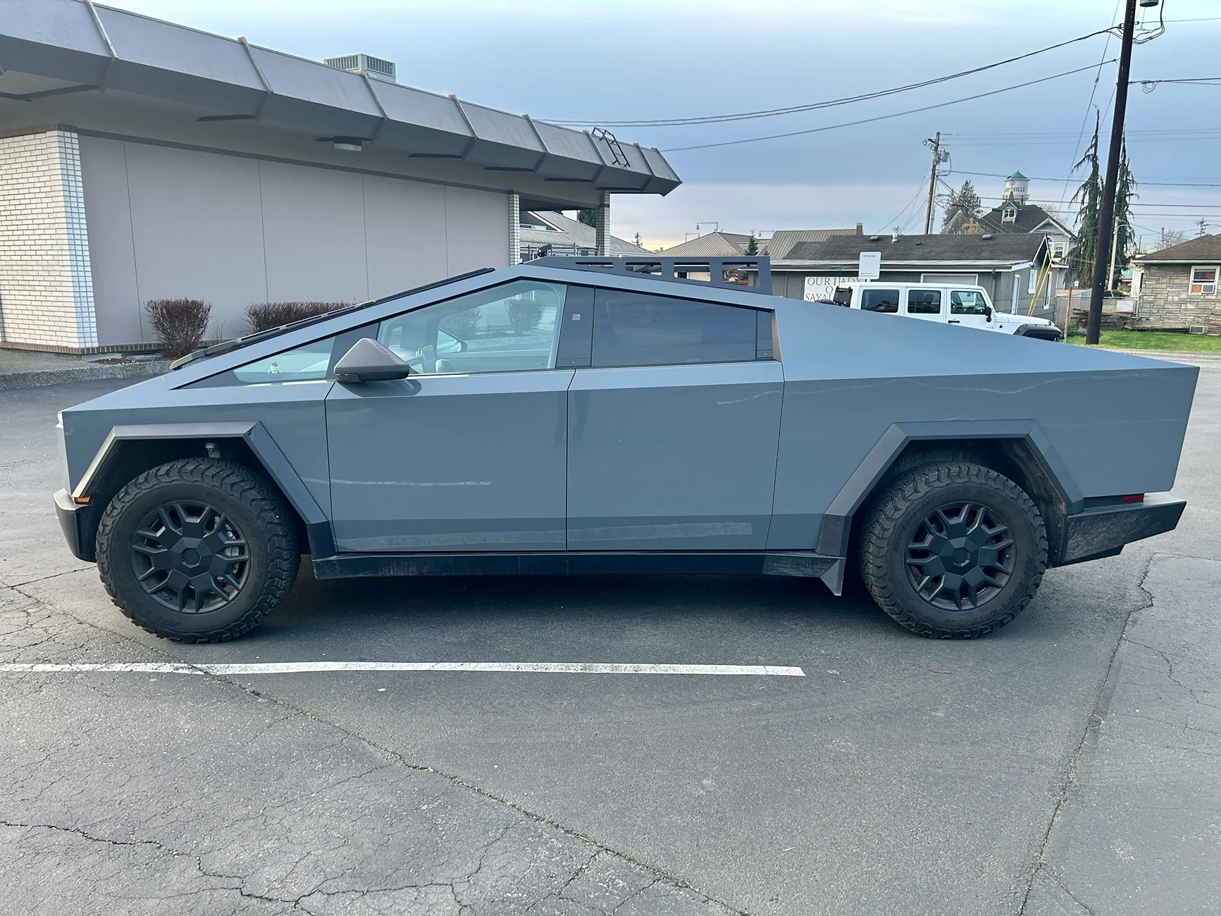 Tesla Cybertruck Showing off fresh Mars Adventure Gear mods: Expedition Rack (front only), wind deflector, and 50” lightbar. IMG_3699