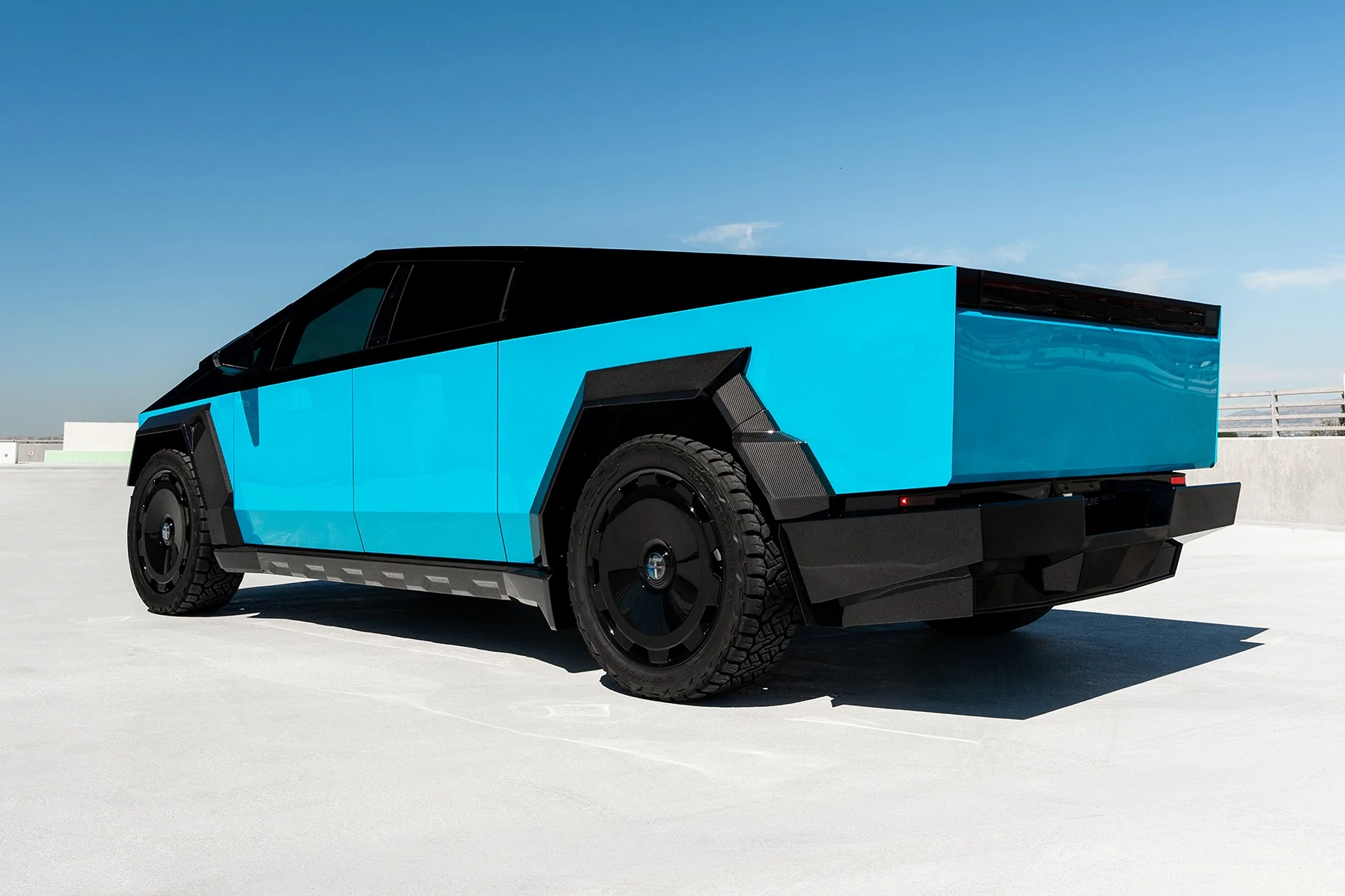 Tesla Cybertruck Two-Tone Miami Blue PPF on Cyber - with custom interior & body kit by T Sportline 2 tmaxx-miami-blue-tesla-cybertruck-gloss-black-upper-24-inch-wheels-ctm-carbon-fiber-wide-bo