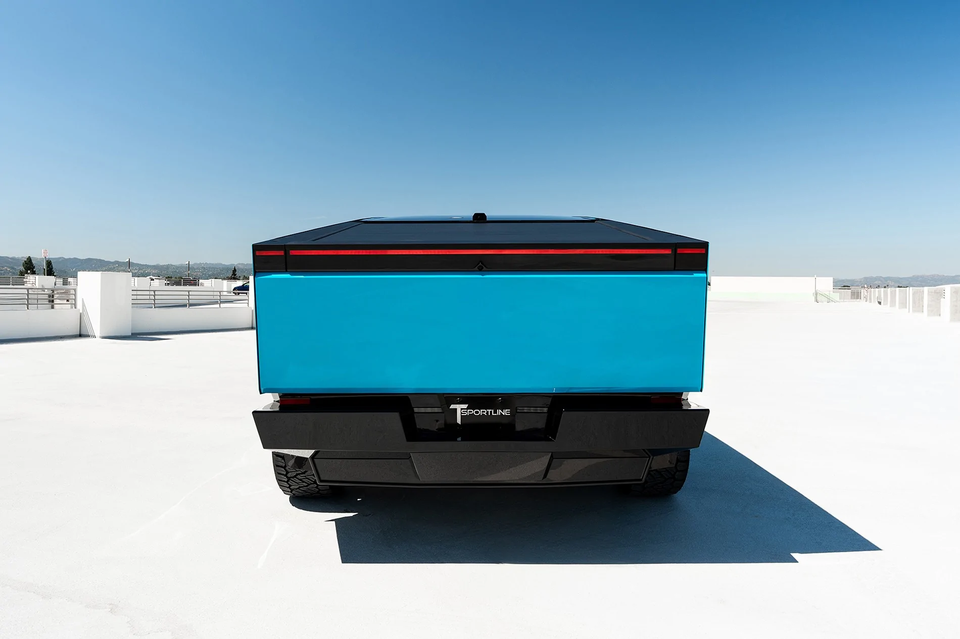 Tesla Cybertruck Two-Tone Miami Blue PPF on Cyber - with custom interior & body kit by T Sportline tmaxx-miami-blue-tesla-cybertruck-gloss-black-upper-24-inch-wheels-ctm-carbon-fiber-wide-body