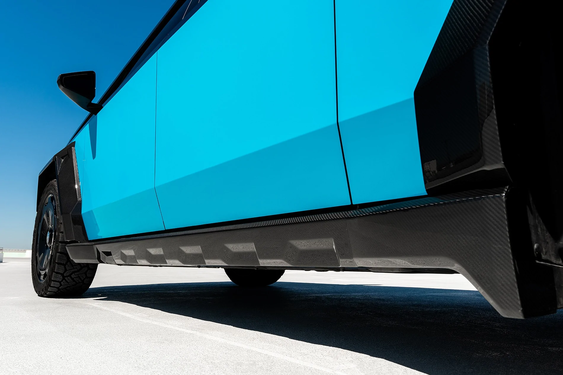 Tesla Cybertruck Two-Tone Miami Blue PPF on Cyber - with custom interior & body kit by T Sportline tmaxx-miami-blue-tesla-cybertruck-gloss-black-upper-24-inch-wheels-ctm-carbon-fiber-wide-body