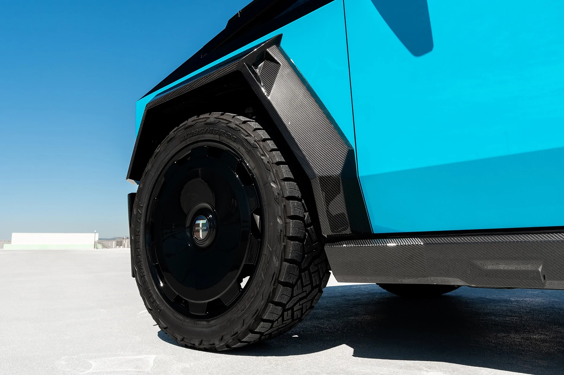 Tesla Cybertruck Two-Tone Miami Blue PPF on Cyber - with custom interior & body kit by T Sportline tmaxx-miami-blue-tesla-cybertruck-gloss-black-upper-24-inch-wheels-ctm-carbon-fiber-wide-body