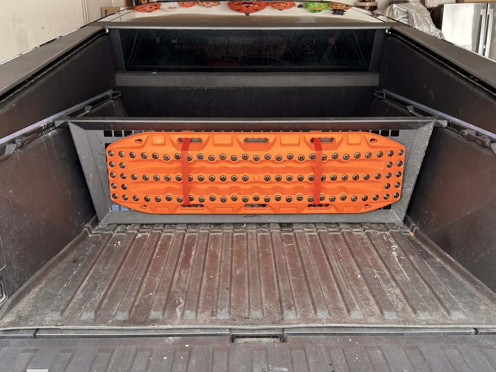 Tesla Cybertruck Max Trax recovery boards installed on Tesla Molle panel 1776871516318-b8