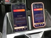 Tesla Cybertruck HARDWARE FIX for hot phone charging issue! New wireless charger has a built-in heatsink phones-charging-imag