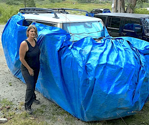 Tesla Cybertruck Cybertruck pic - in lowest air suspension mode & windows down marmot-tarp-1