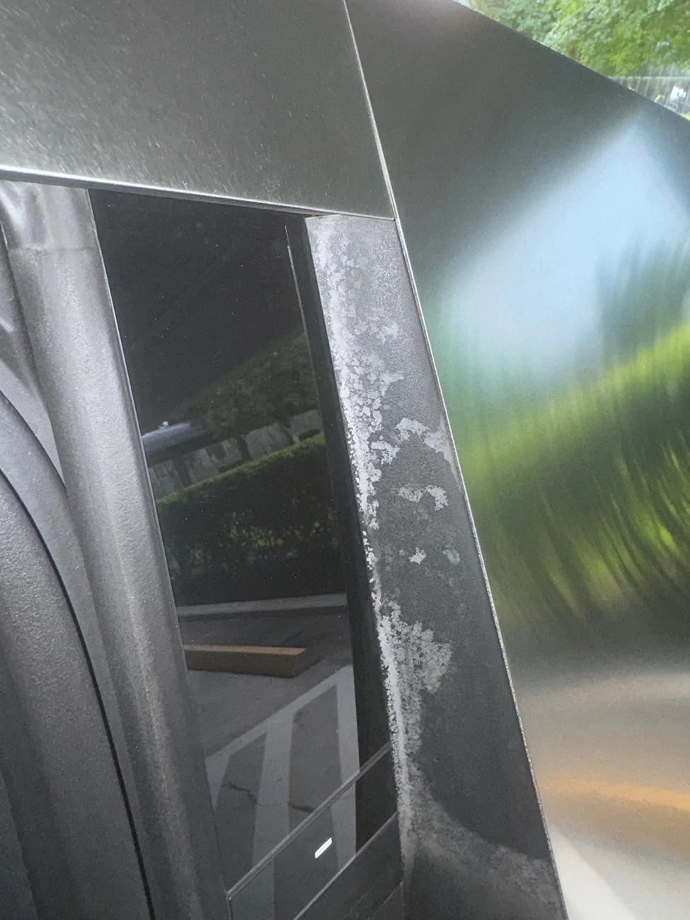 Tesla Cybertruck Strange scale/discoloration on trim near rear doors. Any ideas? scal