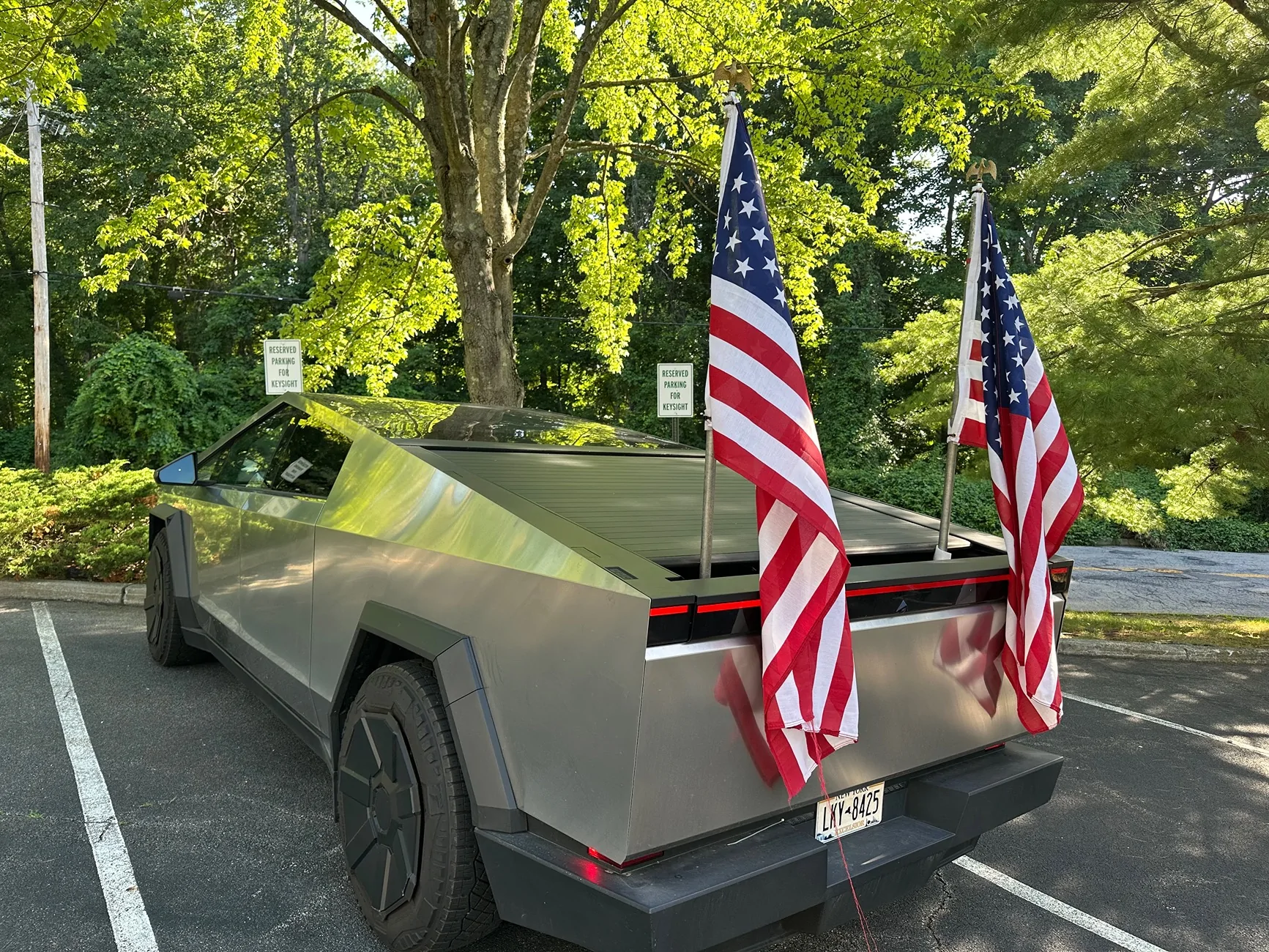 Tesla Cybertruck Flying American flags on Cybertruck - a solution using bed divider IMG_2234