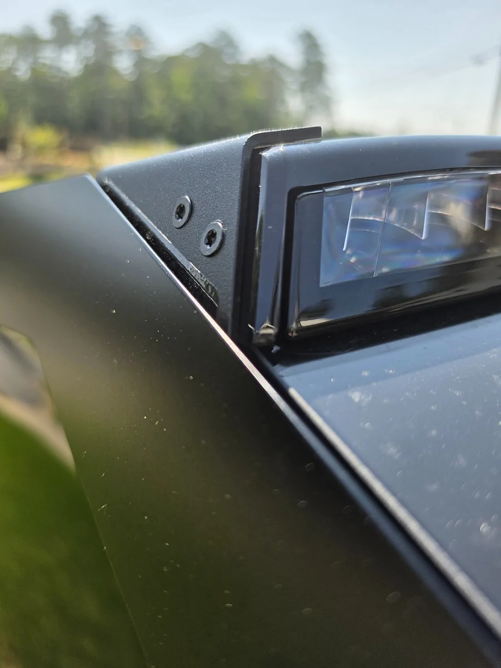 Tesla Cybertruck Does anyone know what the plastic film on the outside of the light bar brackets is for? 17832639570673279644260766510331