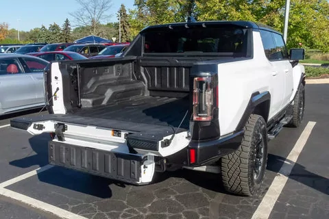 Tesla Cybertruck GM Hummer vs Tesla Cybertruck - Complete Review. bed-exterior-step-rails-truck-white-scaled_480x480