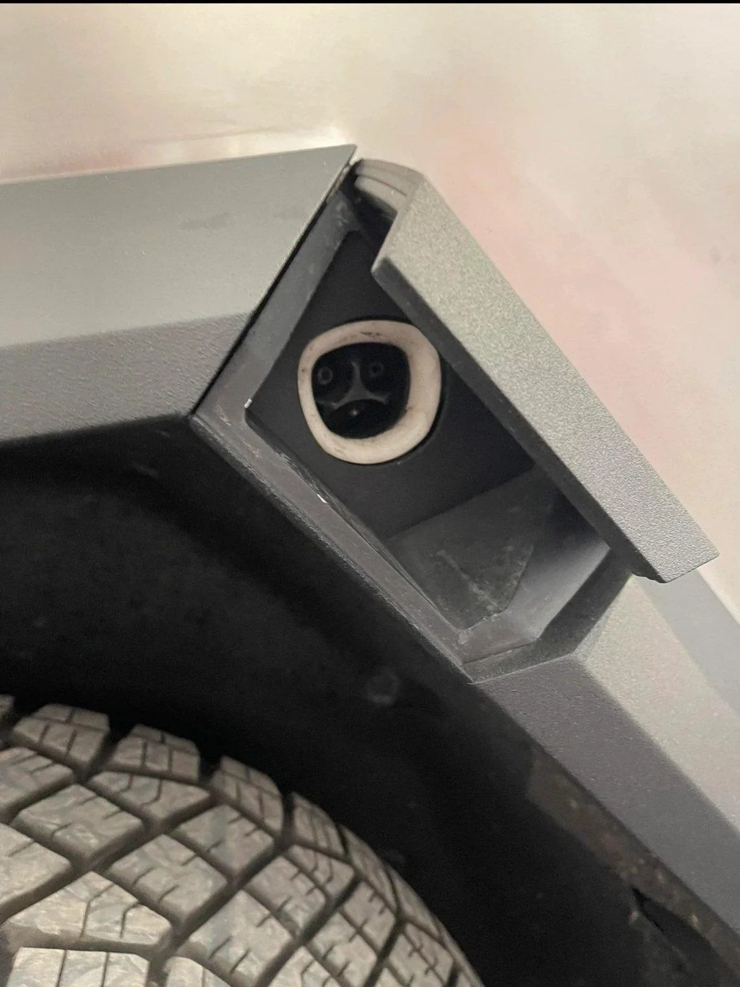Tesla Cybertruck New Cybertruck chargeport picture reveals special Tesla logo FgmwwoFUcAE8BUT