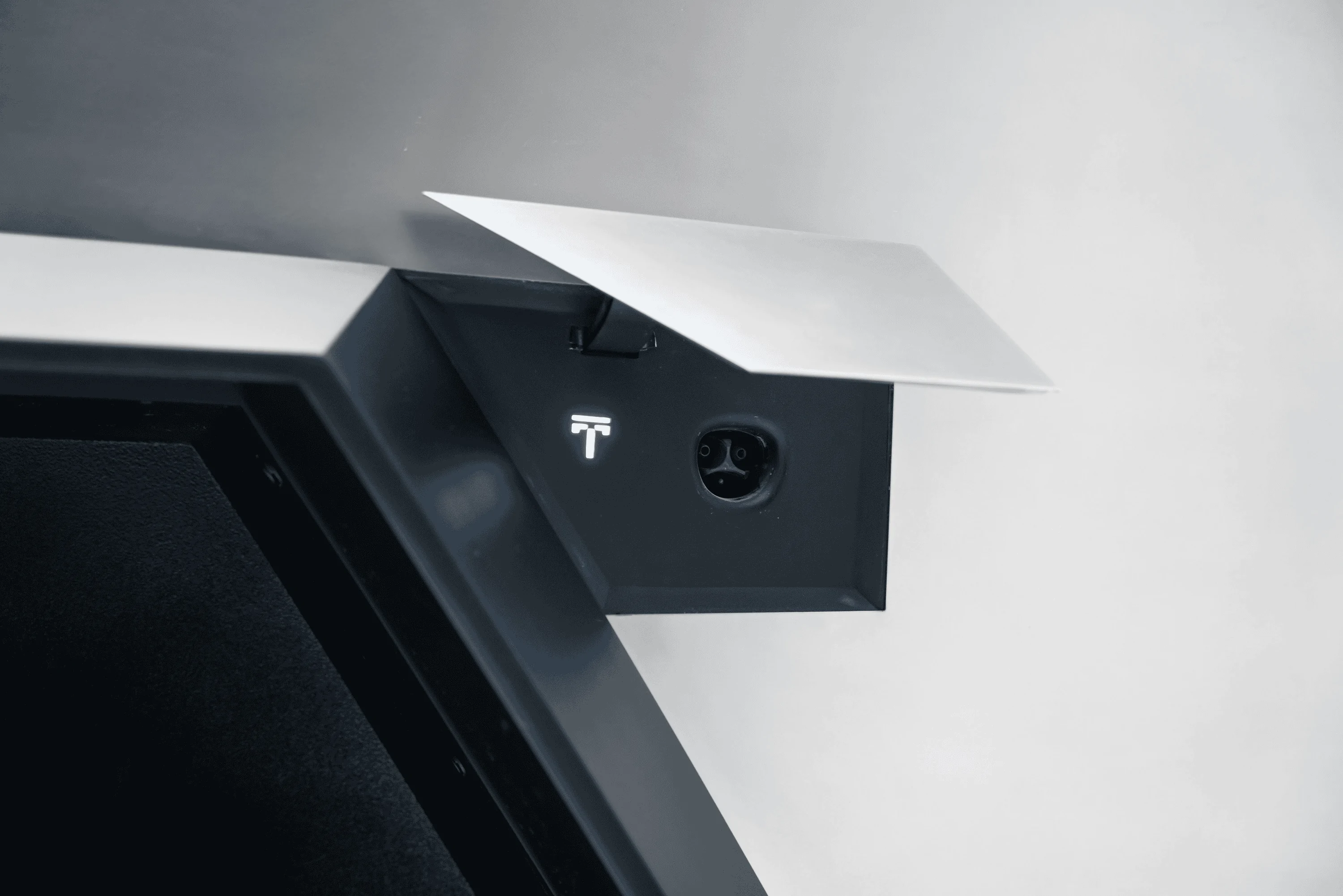 Tesla Cybertruck New Cybertruck chargeport picture reveals special Tesla logo 1667505309801