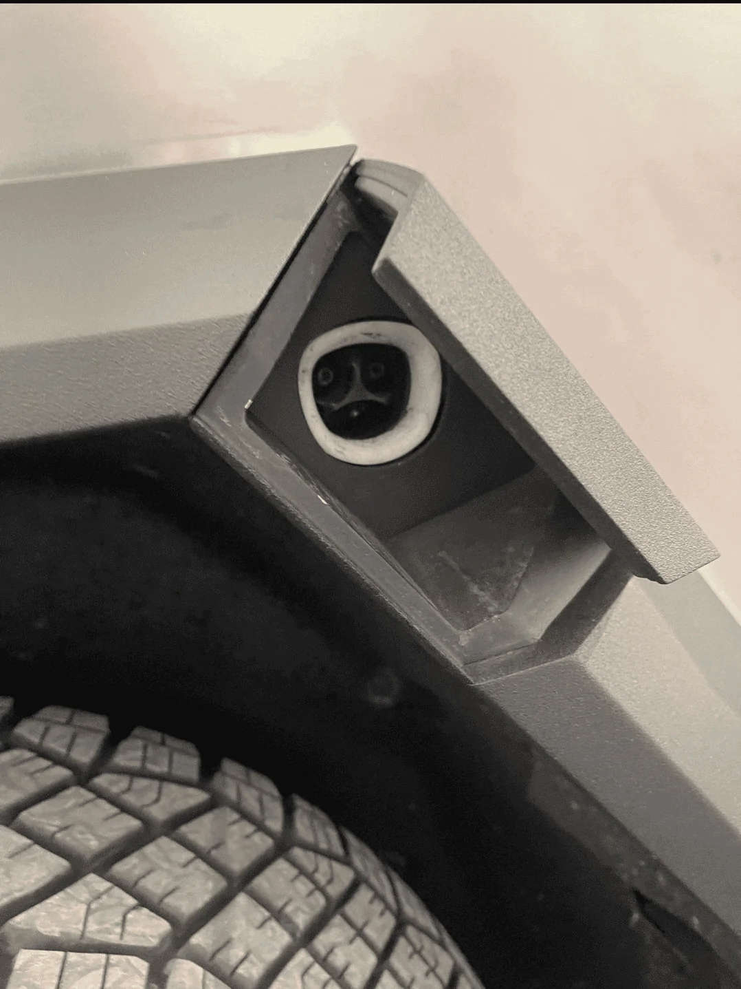 Tesla Cybertruck New Cybertruck chargeport picture reveals special Tesla logo 1667575420265