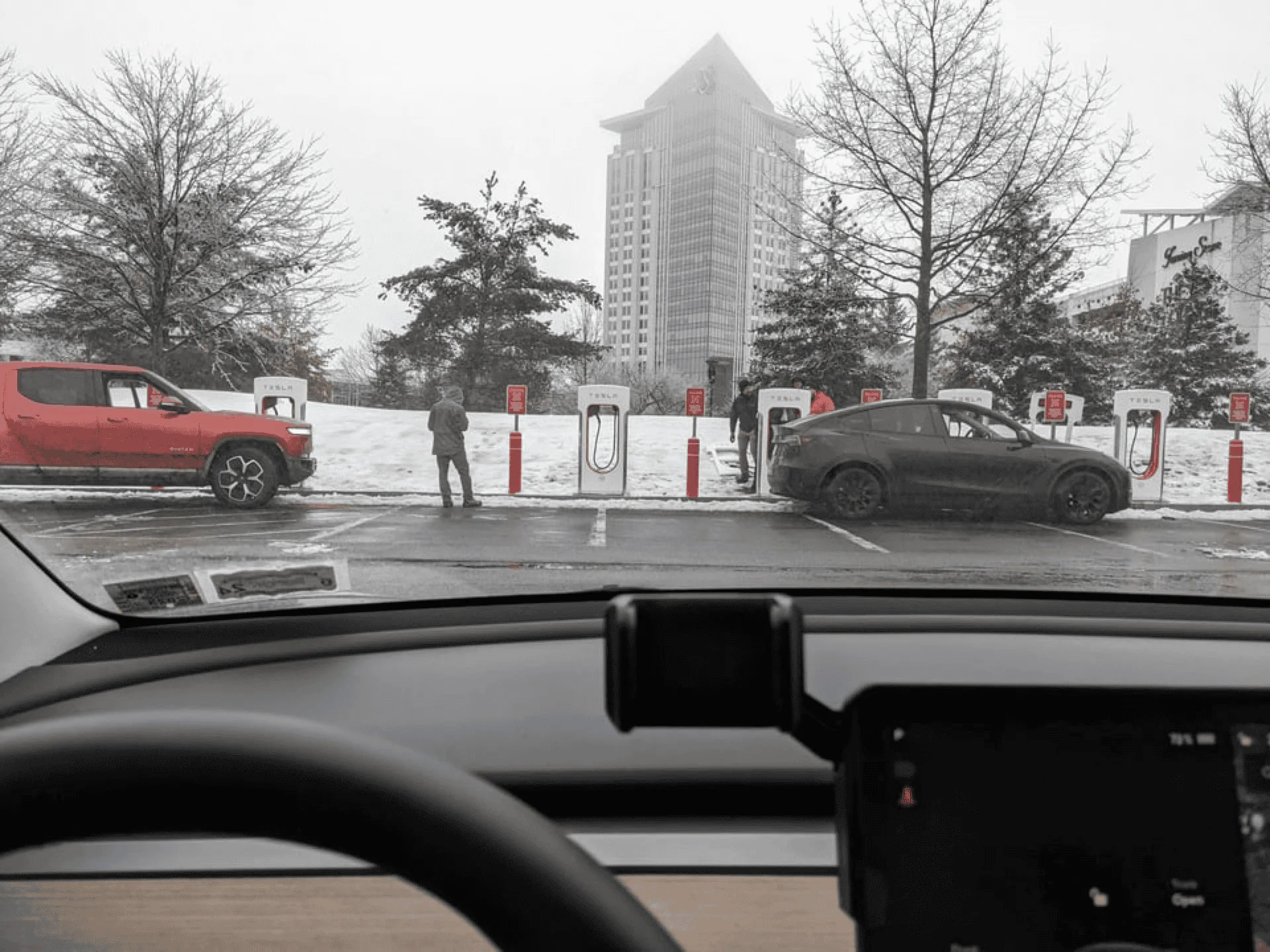 Tesla Cybertruck First Supercharger with Magic Dock CCS Adapter charges up a Rivian 1677186197072