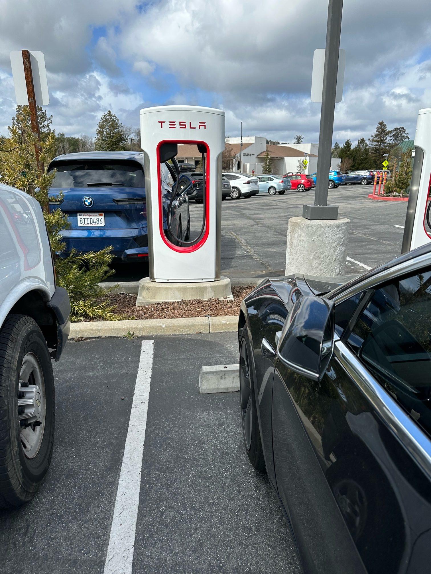 Tesla Cybertruck First Supercharger with Magic Dock CCS Adapter charges up a Rivian tesla
