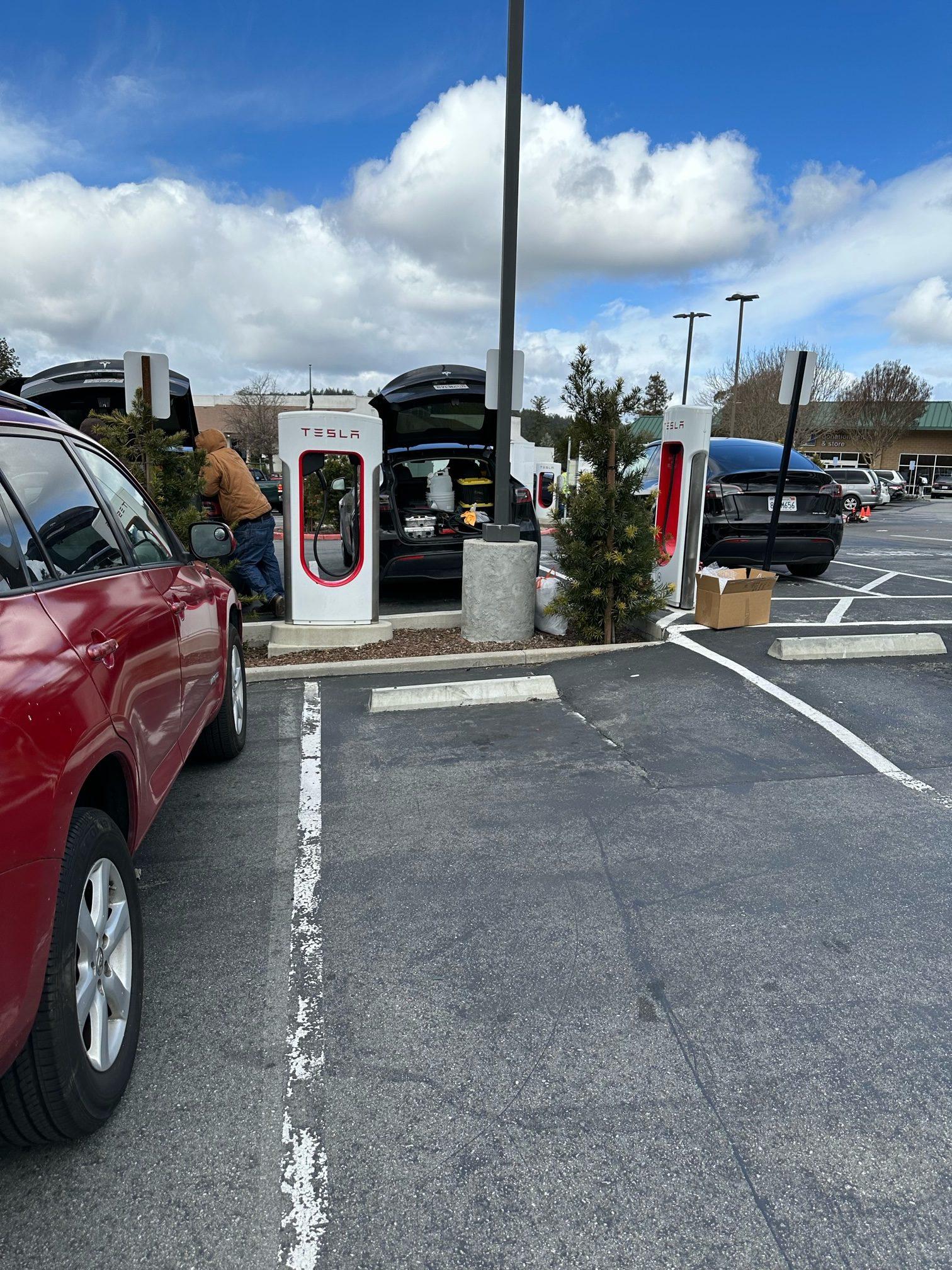 Tesla Cybertruck First Supercharger with Magic Dock CCS Adapter charges up a Rivian tesla 3