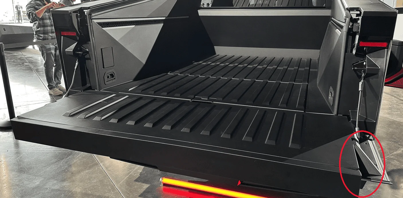 Tesla Cybertruck What is this wedge looking piece coming off the side of tail gate ? 1677768345980