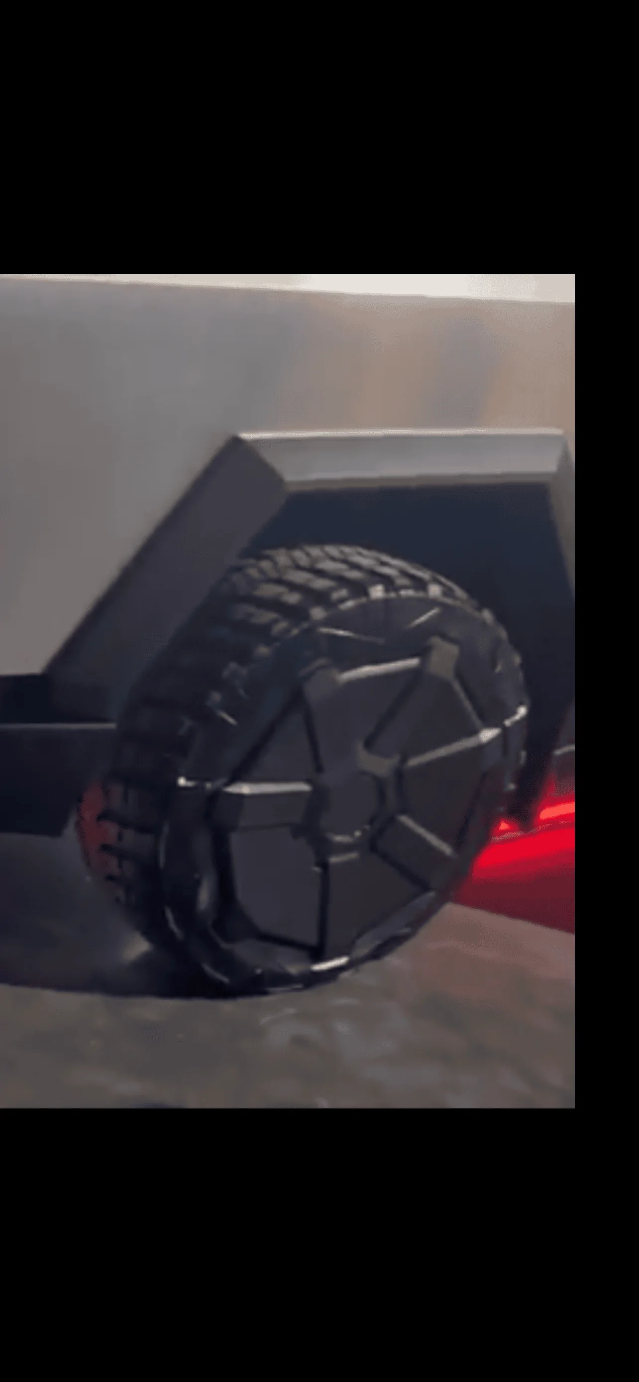Tesla Cybertruck What is this wedge looking piece coming off the side of tail gate ? 967EE3C6-A2B7-4877-A07F-E3698AAE0F24