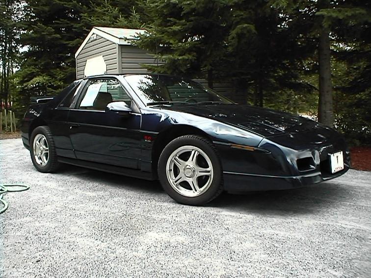 Tesla Cybertruck I used AI to blend the Cybertruck with other vehicles.  Here are the results. Fiero 2003 2 (1)