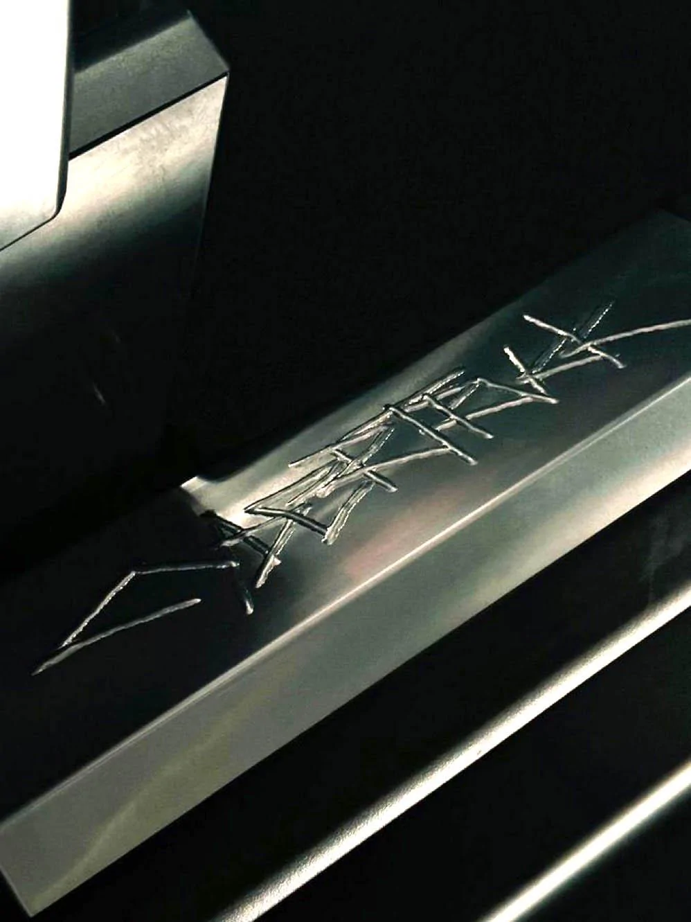 Tesla Cybertruck Door sill plate w/ Cybertruck logo spotted on beta prototype tesla cybertruk door sill logo etched