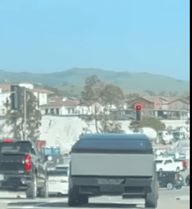Tesla Cybertruck Cybertruck spotted driving next to Chevy Silverado! 1682173679309