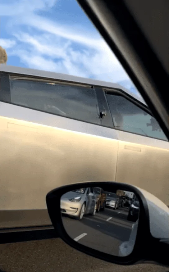 Tesla Cybertruck What's this? Are they fly window locks? Cameras for the Leno show? Rear window locks to fold it down? 1592409316592